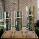 Drie British Berkefeld modellen naast elkaar: 6L, 8.5L en 12L